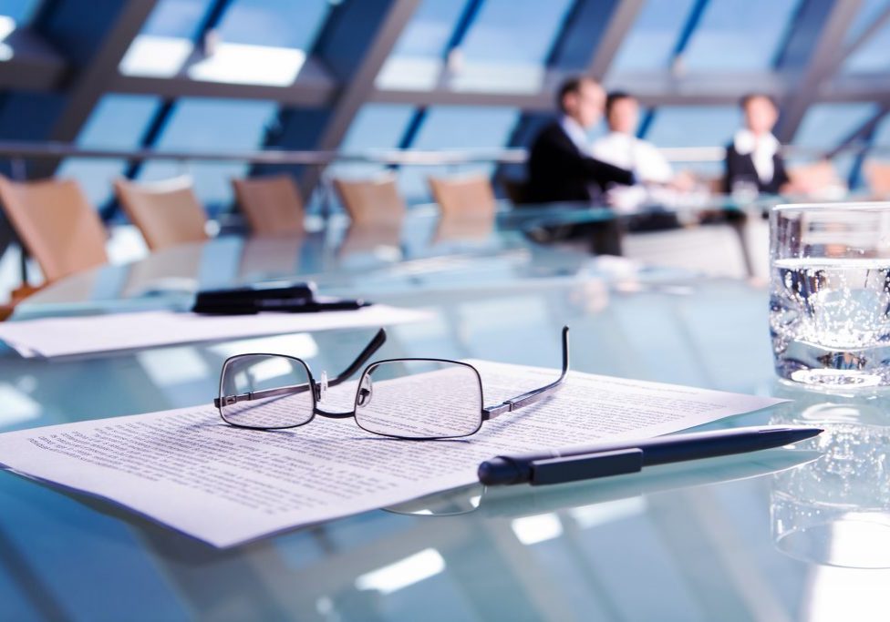 Image of several objects lying on the table in the conference room